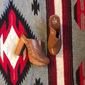 Brown leather clogs